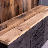 Military-style console table with metal frame, wooden top, and 26 drawers